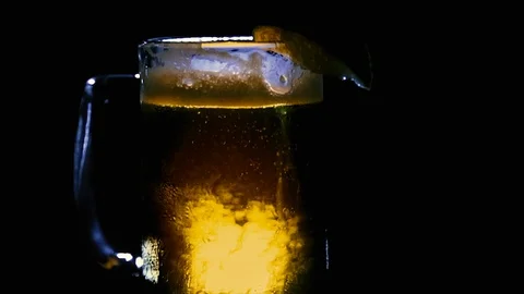 Close Up Rotating Beer in Mug, Backlit Only 動画素材 93971466