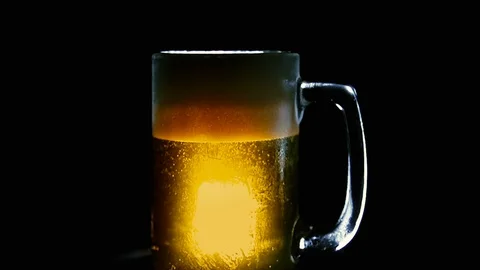 Close Up Rotating Beer in Mug, Extra Froth, Backlit Only 動画素材 93971387