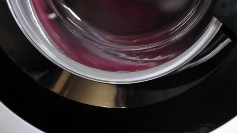 Close-up of a rotating cylinder of a washing machine during washing. Stock Footage 232337073