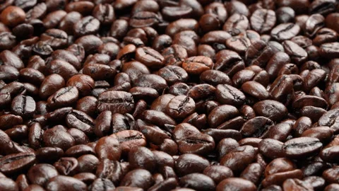 Close Up Rotating Dark Roasted Coffee Beans Texture Видео 331927456