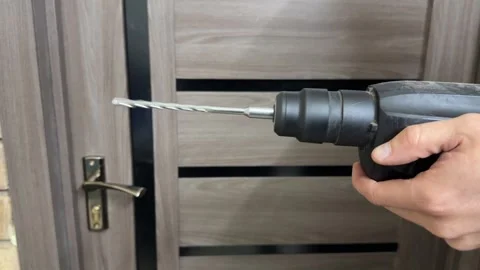 Close up rotating drill bit in motion, power tool operation and construction Stock Footage 337119346