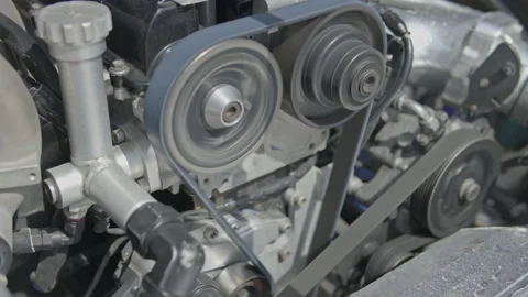 Close-up of rotating engine cam gears and reservoir tank Vídeos de archivo 340773075