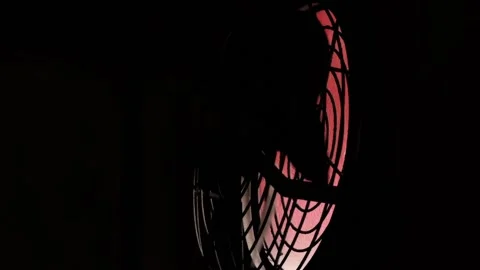 Close up rotating fan bladders in a dark room Stock Footage 205550345