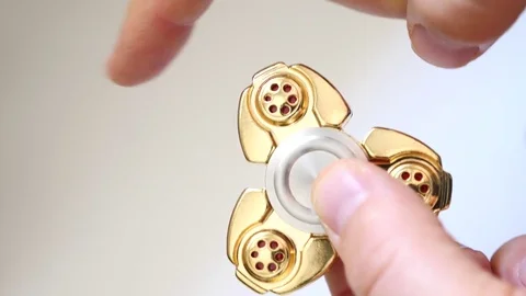 Close up of rotating fidget spinner Stock Footage 75070852