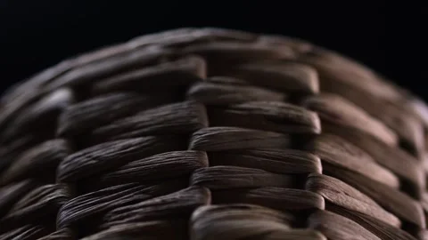 Close-up on a rotating, handcrafted, dark brown natural wicker basket, exem.. Stock-Footage 264304696