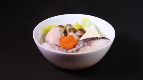Close-up of rotating individual serving of Yose-nabe in a ceramic bowl Stock Footage 325634298
