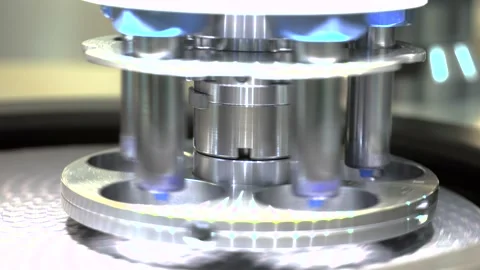 Close-up of rotating industrial machine with test tubes. HDR. Steel machine with Stock Footage 153473014