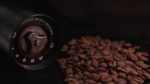 Close-up rotating inner part of steel coffee beans grinder ground coffee spills Stock Footage 263142109
