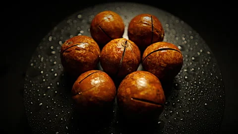 Close Up Rotating Macadamia Nuts in 50p Stock Footage 336721722