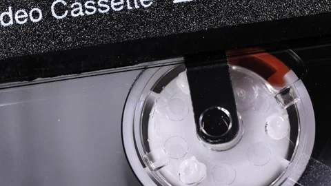 Close Up Rotating Old Camcorder Cassette Reel Video stock 331282315