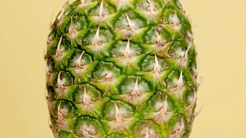 Close up of rotating pineapple Stock Footage 119955819