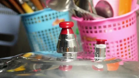 Close up of rotating pressure cooker lid Stock Footage 306760237