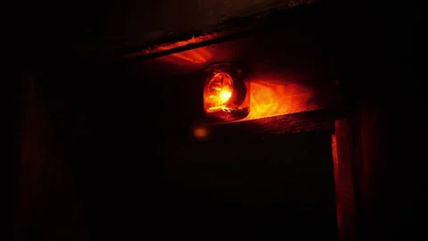 Close-up of a rotating red emergency siren lamp on the wall of a dark tunnel. Stock Footage 288332930