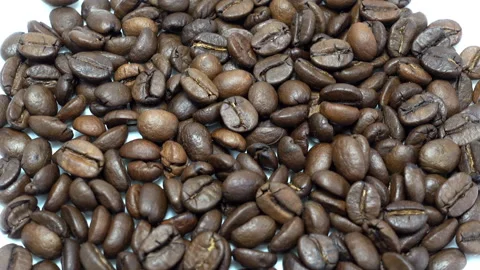 Close-up of rotating roasted coffee beans. Stock Footage 87094884