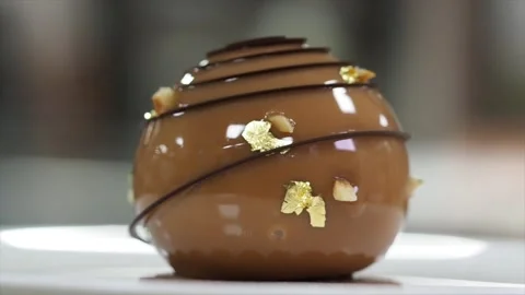 Close Up Of A Rotating Round Shaped Gourmet Chocolate Mousse Cake - HD Stock Footage 133138062