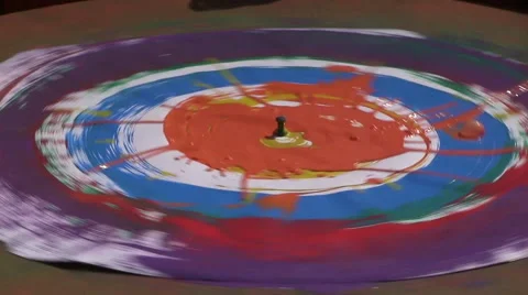 Close up - rotating table with a sheet of paper gets color Stock-Footage 40063677