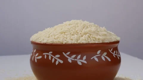 Close rotating view of mud bowl filled with rice 動画素材 147693867