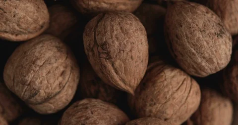 Close-up of the rotation of the background made from walnuts 스톡 동영상 95932110