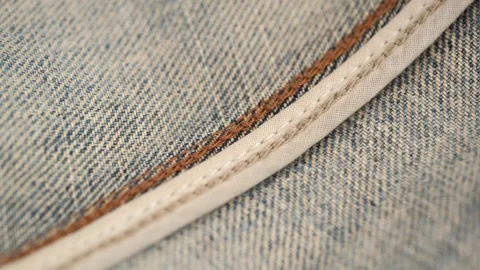 Close up rotation of carefully crafted inner seam of jeans. wrong side of jeans. Stock Footage 263822321