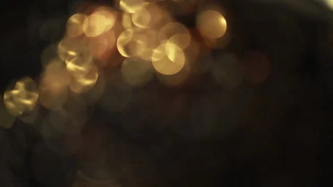Close-up of a rotation in a circle of yellow bokeh lights. 스톡 동영상 134996870