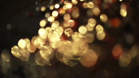 Close-up of a rotation in a circle of yellow bokeh lights. 스톡 동영상 135104708