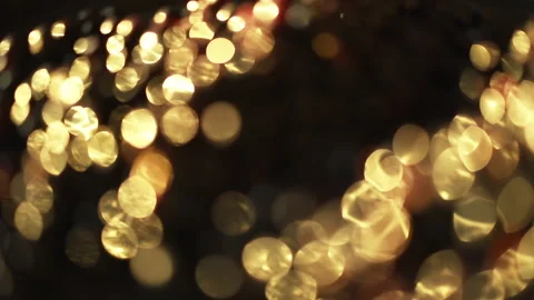 Close-up of a rotation in a circle of yellow bokeh lights. 스톡 동영상 135104859