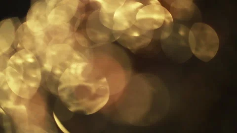Close-up of a rotation in a circle of yellow bokeh lights. 스톡 동영상 135109221