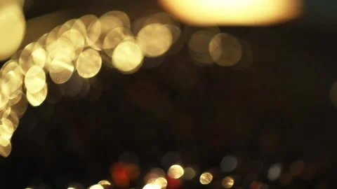 Close-up of a rotation in a circle of yellow bokeh lights. 스톡 동영상 135125401