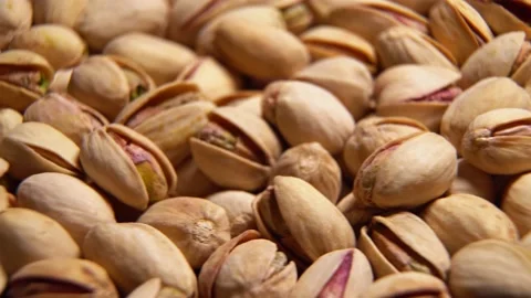 Close-up rotation of fried pistachios Stock Footage 132717896