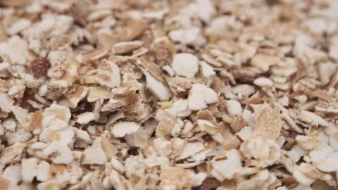 Close up of rotation oat flakes. Healthy vegan morning meal for diet Stock Footage 284616606