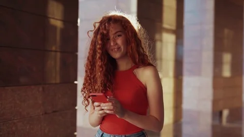 Close up rotation view of pretty curly ginger student girl in trendy outfit Stock Footage 115669599