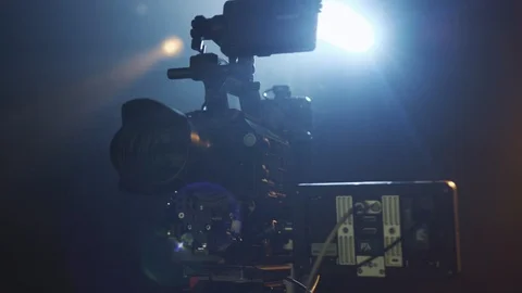Close up rotation view of professional digital video camera in bright light Stock Footage 104885524
