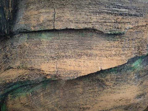 Close-up of rough artificial stone texture with brown paint Stock Photos