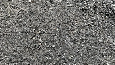 Close-up of rough asphalt surface with embedded gravel, Photos