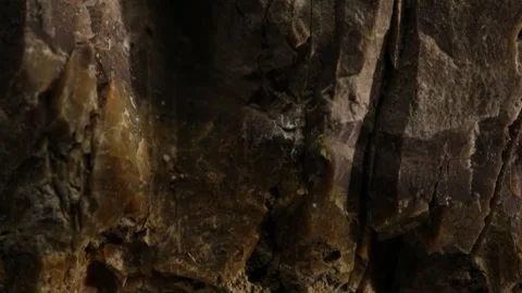 Close-up of rough brown stone with vertical cracks Stock Footage 287875843