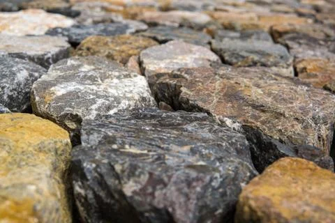 Close up of rough cut stone wall, Background. Photos