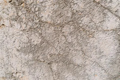 Close-up of rough gray concrete wall texture with cracks Stock Photos