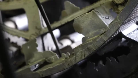 Close up of a rough green metal casting with moulding sand still clinging to 스톡 동영상 347719354