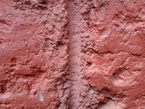 Close-up of Rough Red Painted Concrete Wall Texture Фото