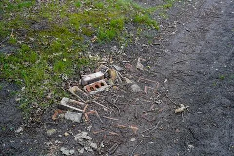 Close up of a rough road made of bricks and rubble 写真素材