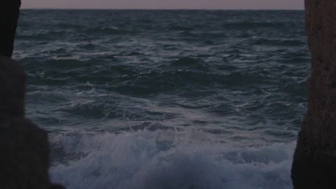 Close-up of rough sea. Waves crashing on the rocks in slow motion. Stock Footage 142074331