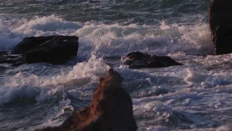 Close-up of rough sea. Waves crashing on the rocks in slow motion. Stock Footage 142076099