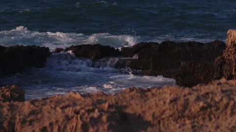 Close-up of rough sea. Waves crashing on the rocks in slow motion. Stock Footage 142077084
