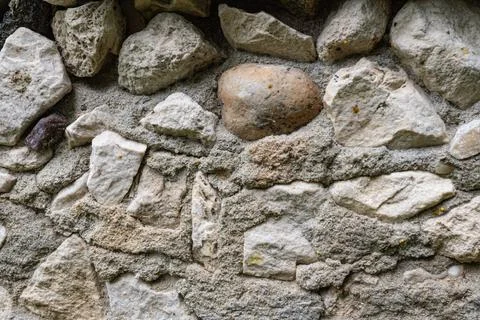 Close-up of rough stone wall with various textures and shapes Stock Photos