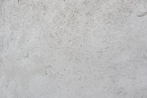 Close-up of a rough, textured grey concrete or cement plaster wall surface Stock Photos