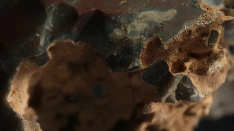 Close-Up of Rough Textured Rock with Natural Cavities Stock Footage 287875697