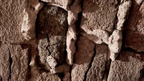 Close Up of Rough Textured Stone Wall with Irregular Rocks and Mortar Lines Video stock 332322763