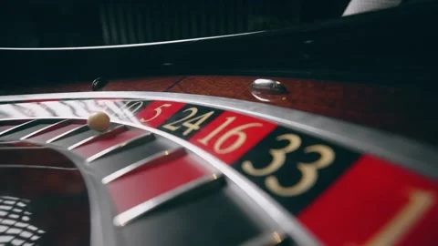 Close up of roulette wheel at the casino in motion. The wheel ball is spinning Stock Footage
