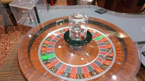 Close-up of a roulette wheel at a gaming table slow motion Stock Footage 324145688