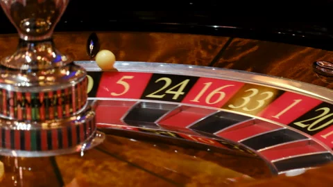 Close-Up of a Roulette Wheel in Motion at a Casino Stock-Footage 308847972